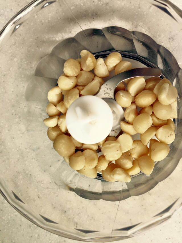 My handy-dandy little mini (2-cup capacity) food processor was again more than up to the task.  Macadamia nuts are naturally rich in oils so no "helper" oil was needed and it didn't take very long to get to the "butter" stage compared to other nut butters.